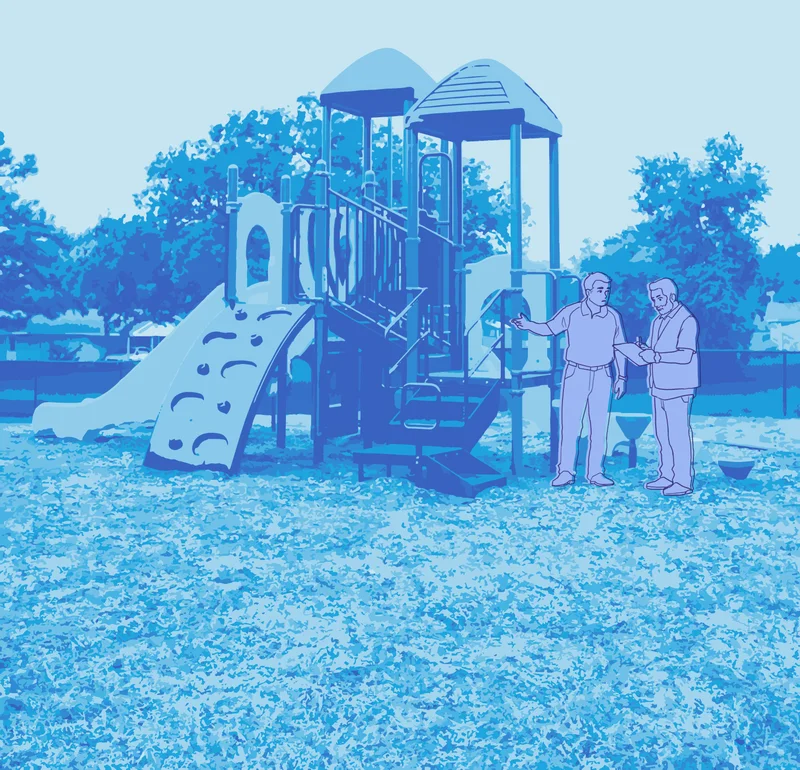 Two maintenance workers reviewing a clipboard beside a kid-scaled play structure