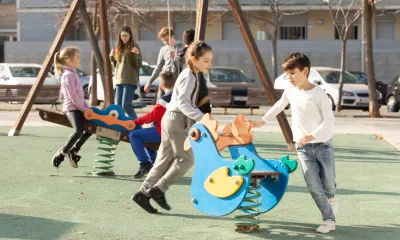 Children developing social skills through collaborative playground activities